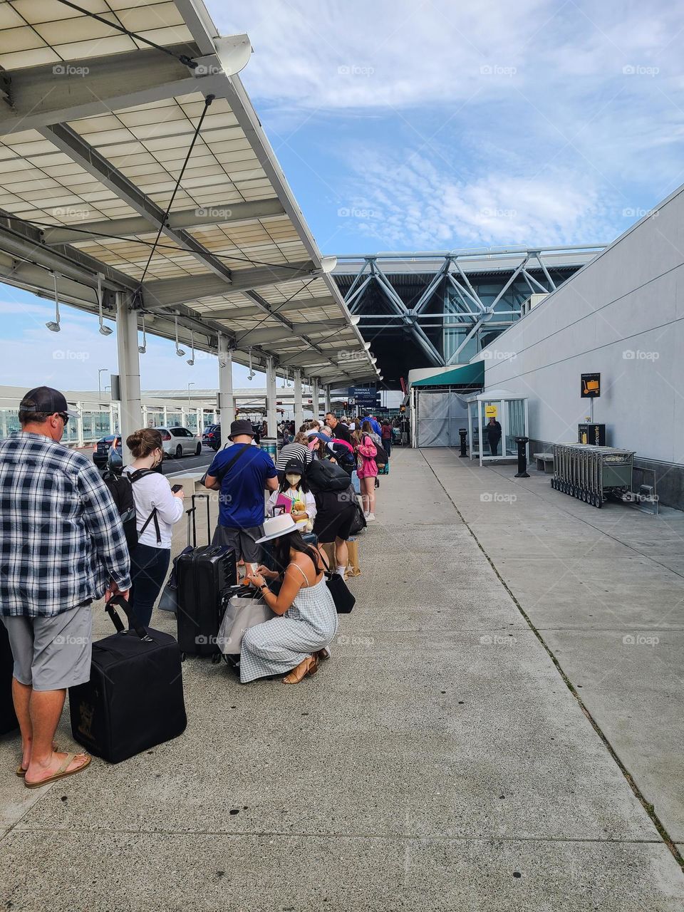 Extremely long line waiting to check in at the Oakland airport on a busy day for flying 