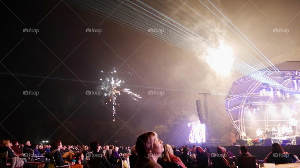 Concert at the park crowd with laser show and fireworks 