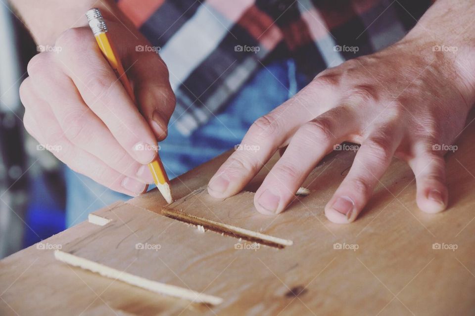 Woodworker Taking Measurements 