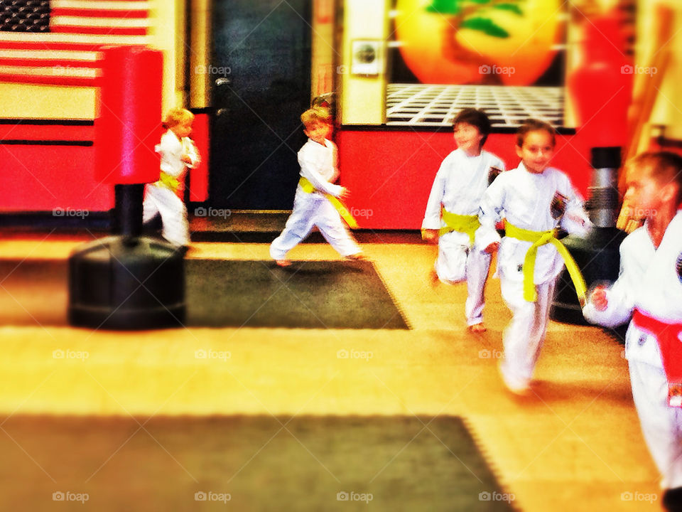 American kids getting exercise at a karate dojo