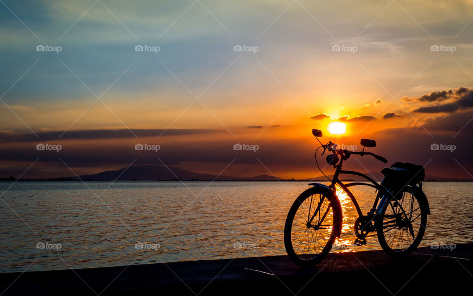 Silhouette of bicycle on beach