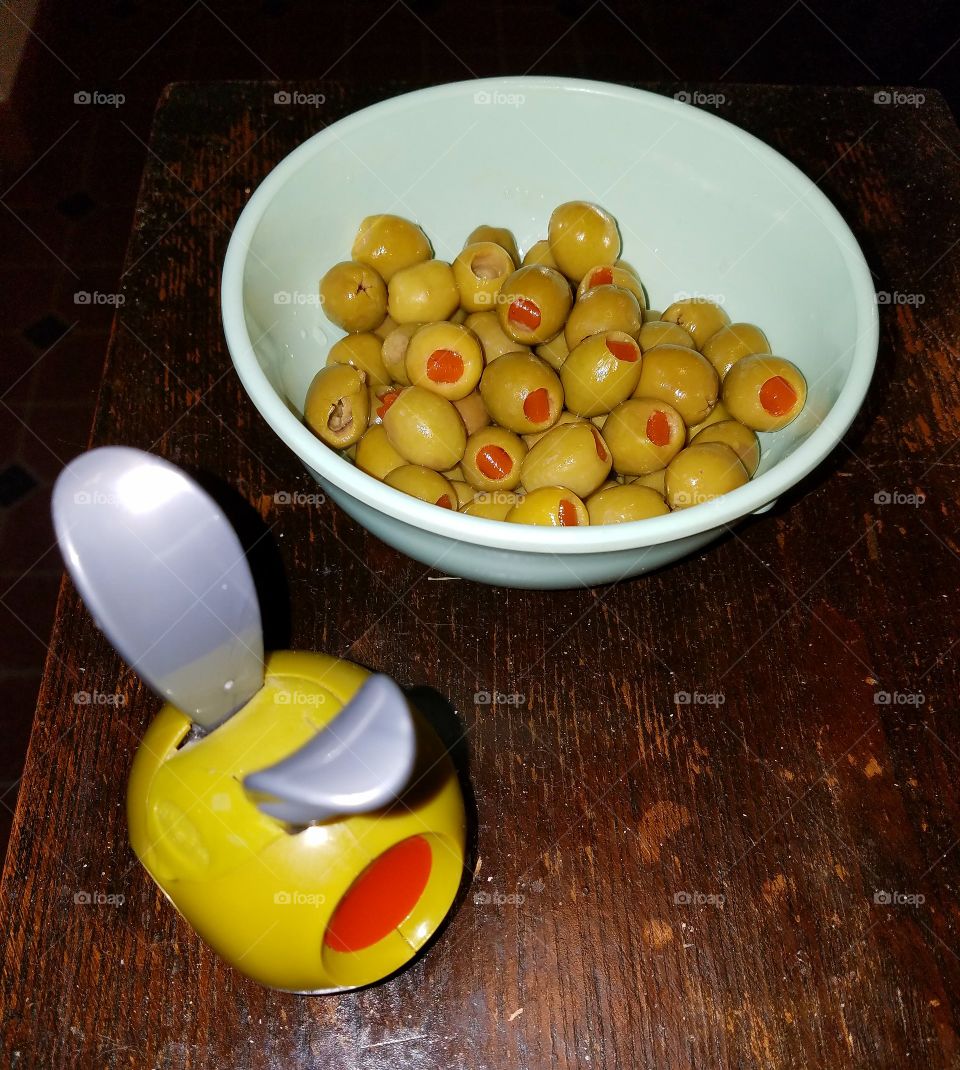 Things that look alike. Green Olive Pepper Mill & Green Olives, pimentos in a dish.