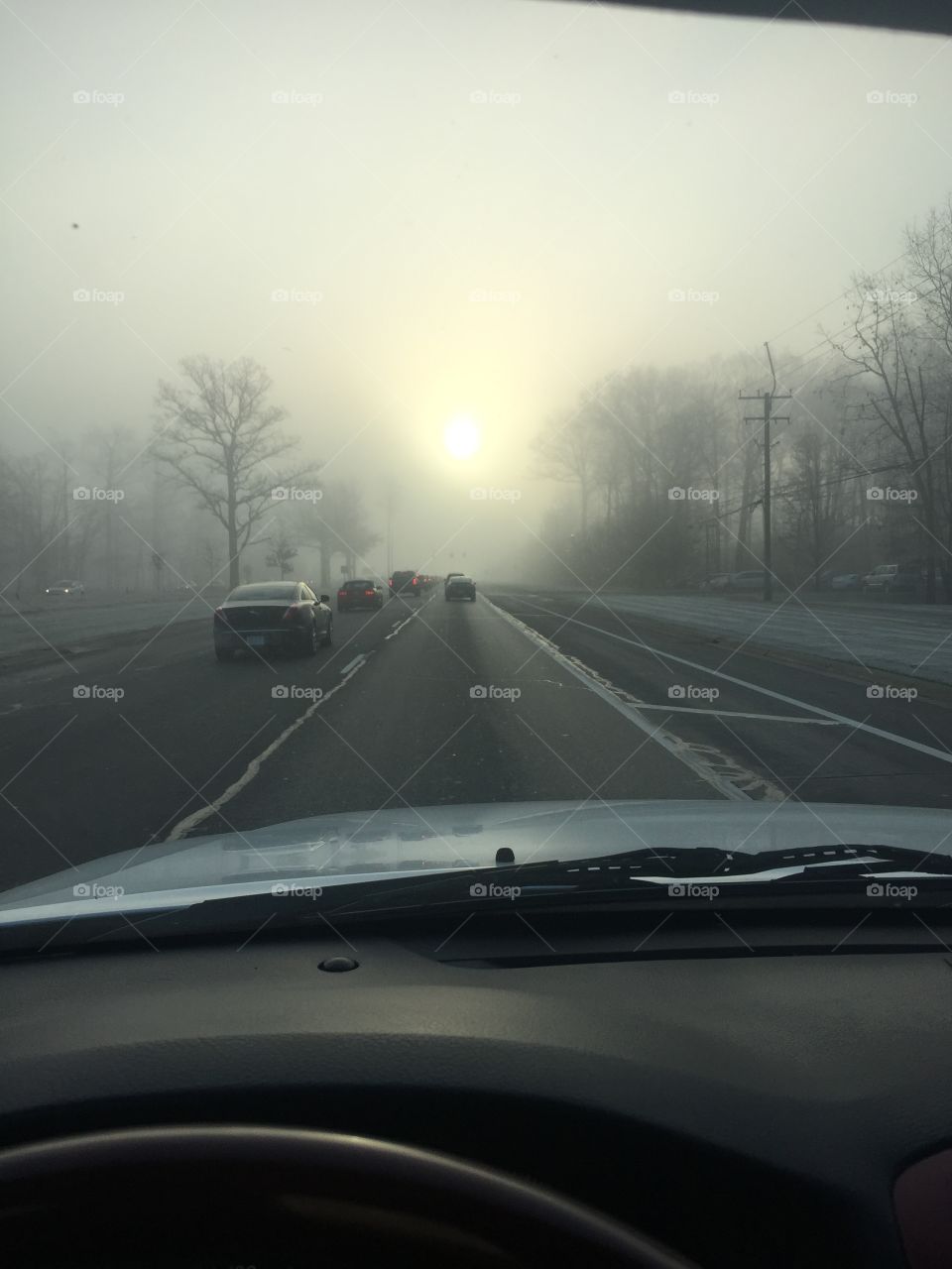 Traffic on a foggy morning. 