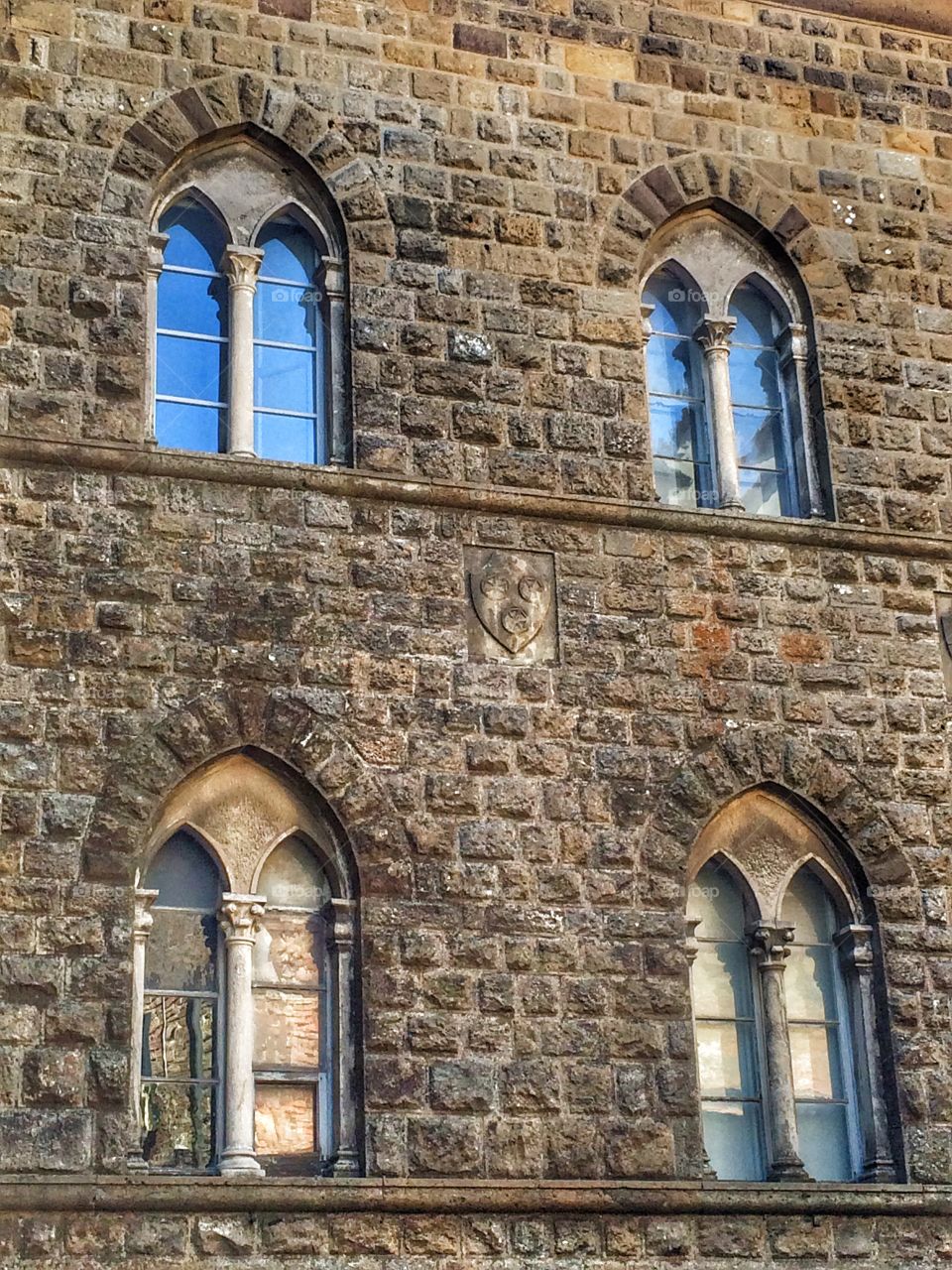 Ancient windows . Volterra's wall 