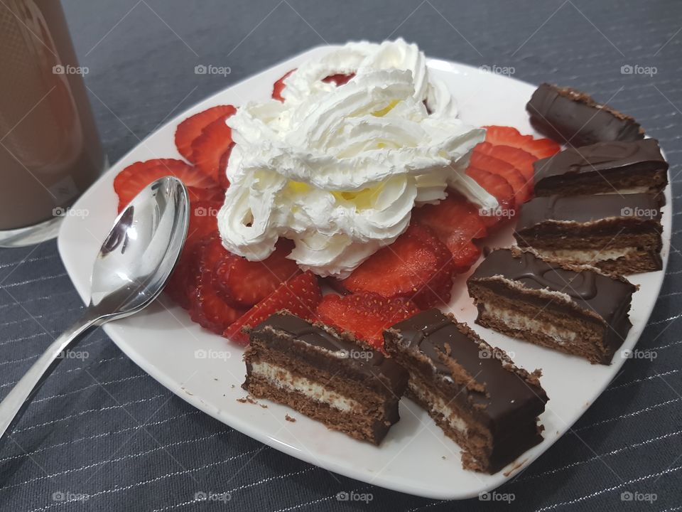 dessert cake with cream and strawberries