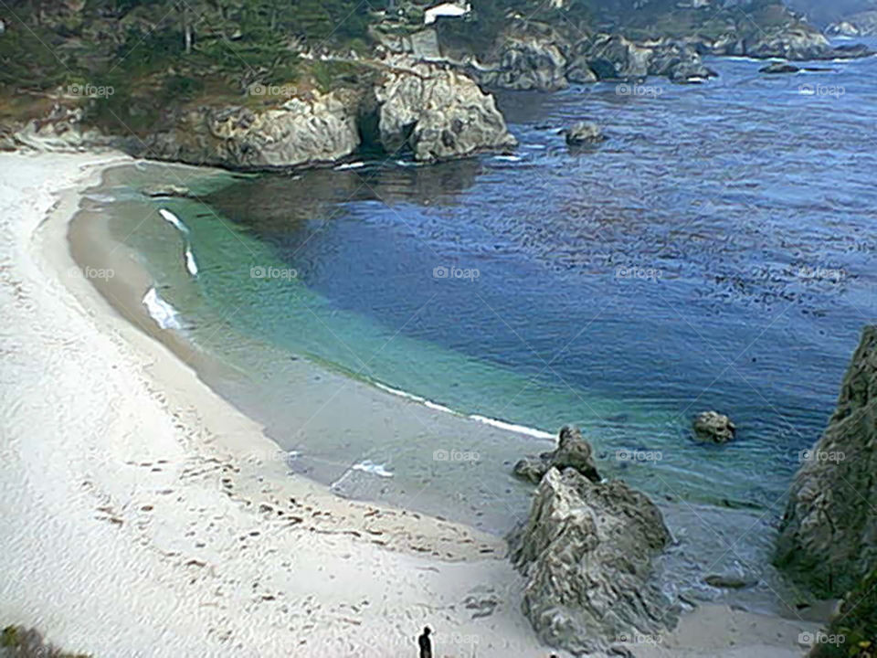Private beach area with clear water