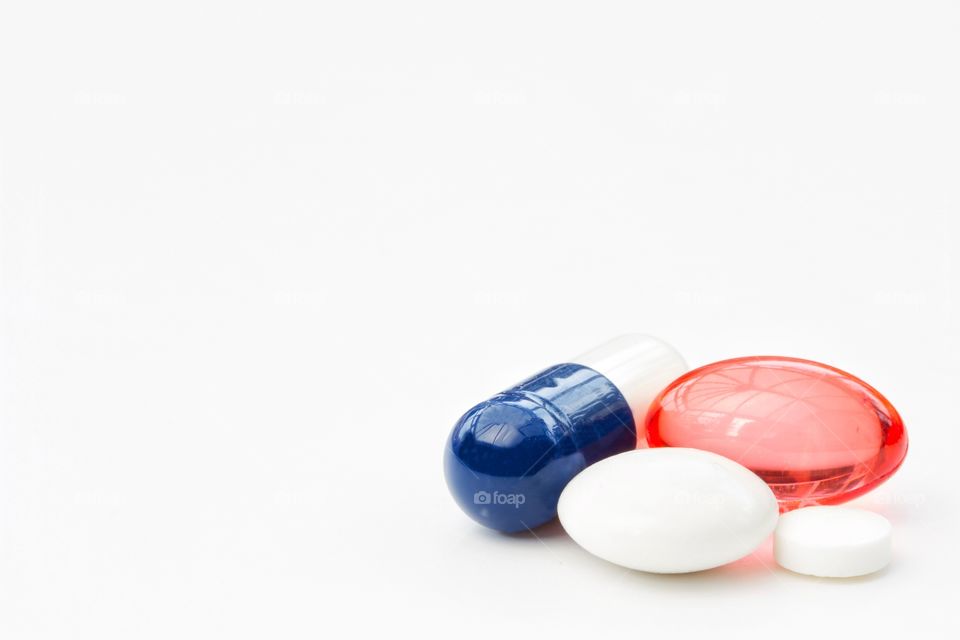 A variety of pharmaceutical pills, tablets and drugs on an isolated white background.