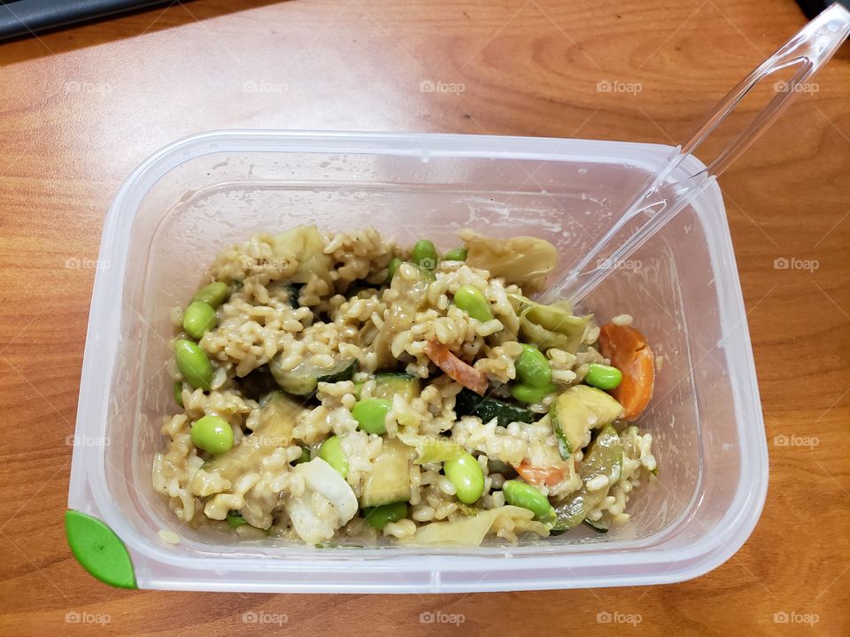 leftovers for lunch at work. brown rice and edamame with stir fry veggies