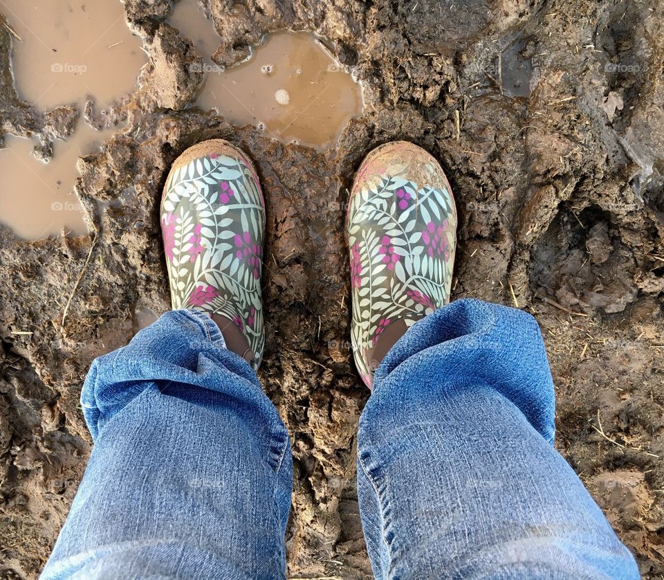 Muddy rubber chore boots. 