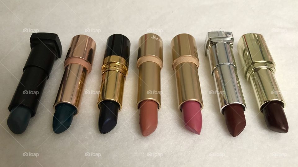 Lipstick shades from dark blues to various reds.