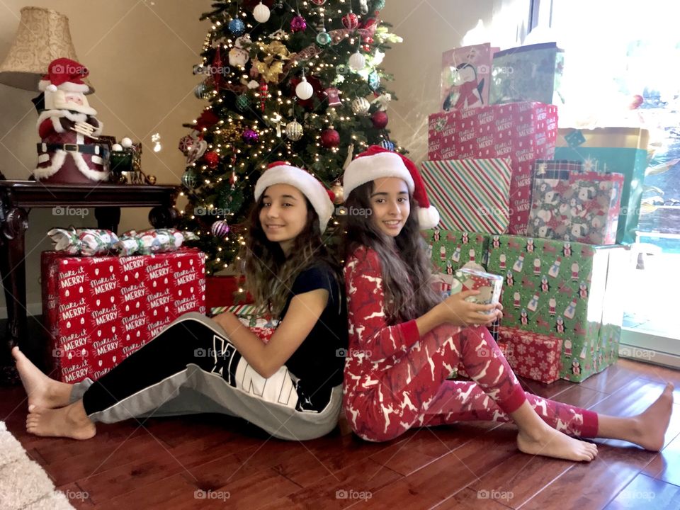 My 12 year old on the left and my 10 year old on the right. Christmas morning. When they stand up the 12 year old is taller than the 10 year old. Lol. 