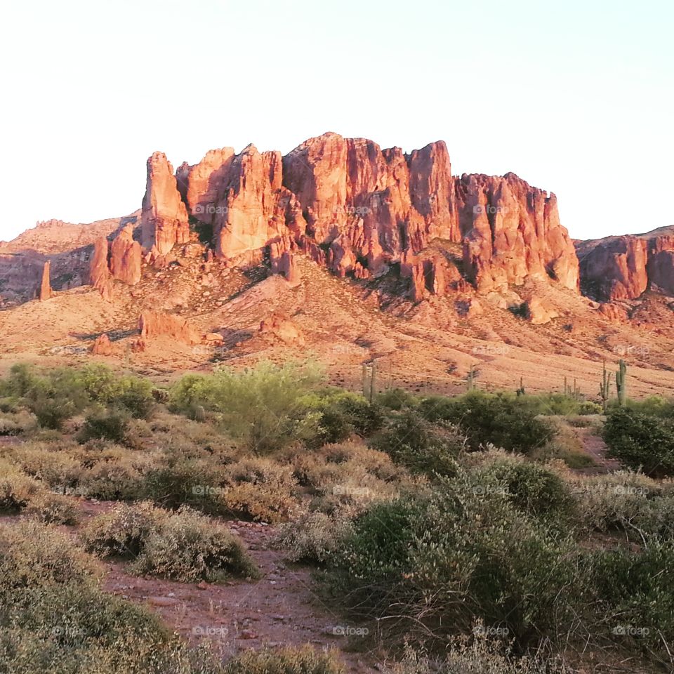 Sunset on the Superstitions. The Superstition Mountains light up against the setting sun in Arizona