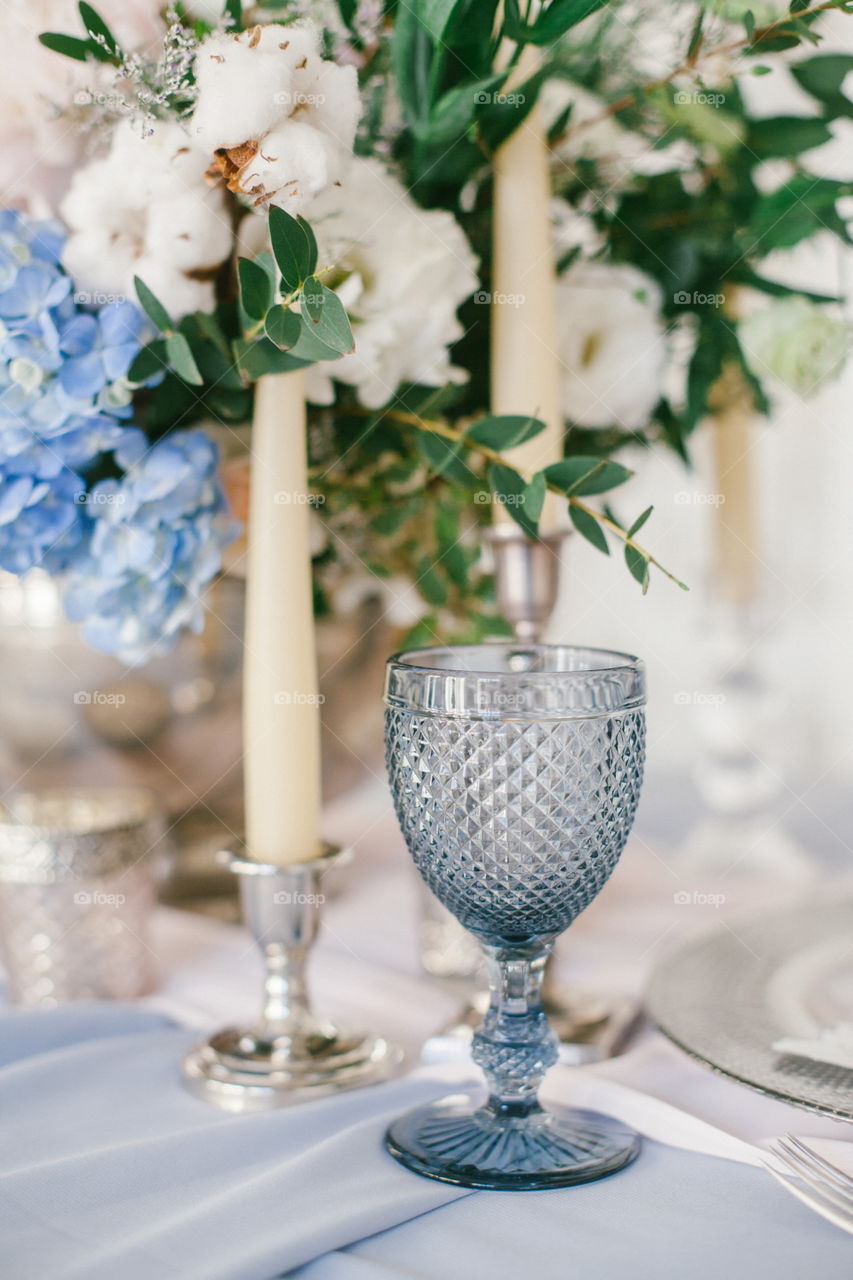 Silver candlestick as element of festive table wedding centerpieces decorations.