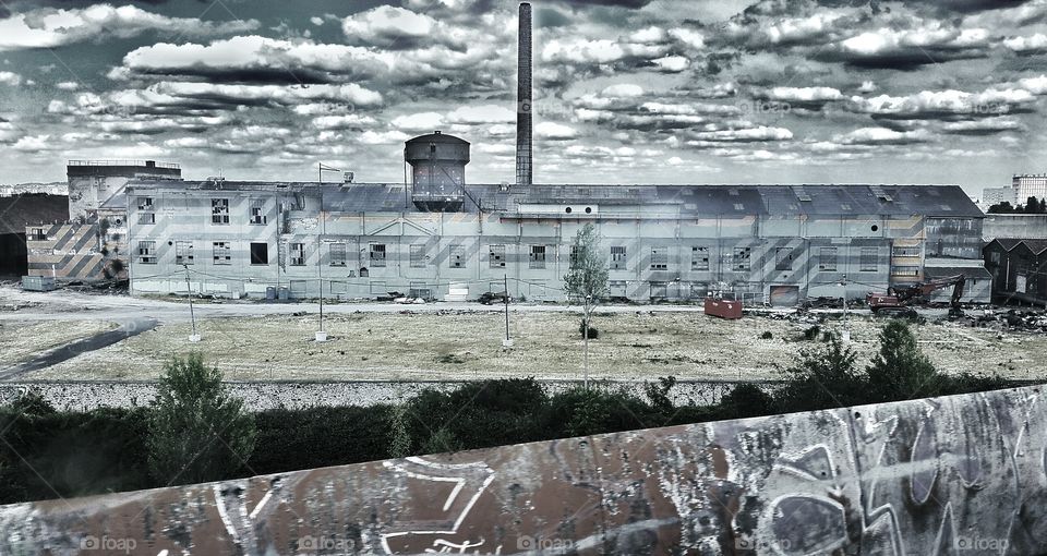 Epic skyes. Abandoned factory serving as a military training camp just outside of Paris. Picture taken with a mobilephone
