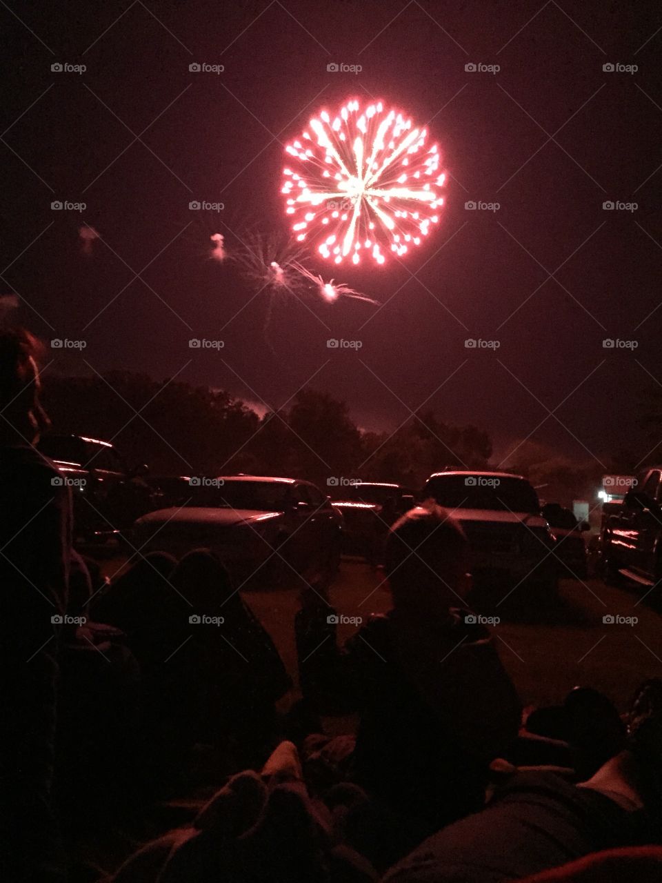 Silhouette of a boy watching fireworks