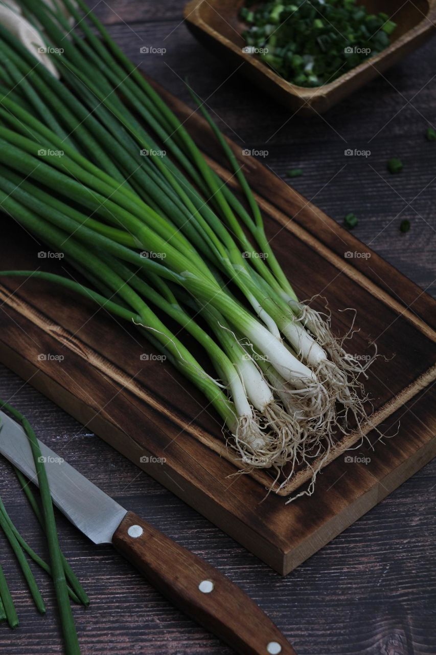 Green onions on the board