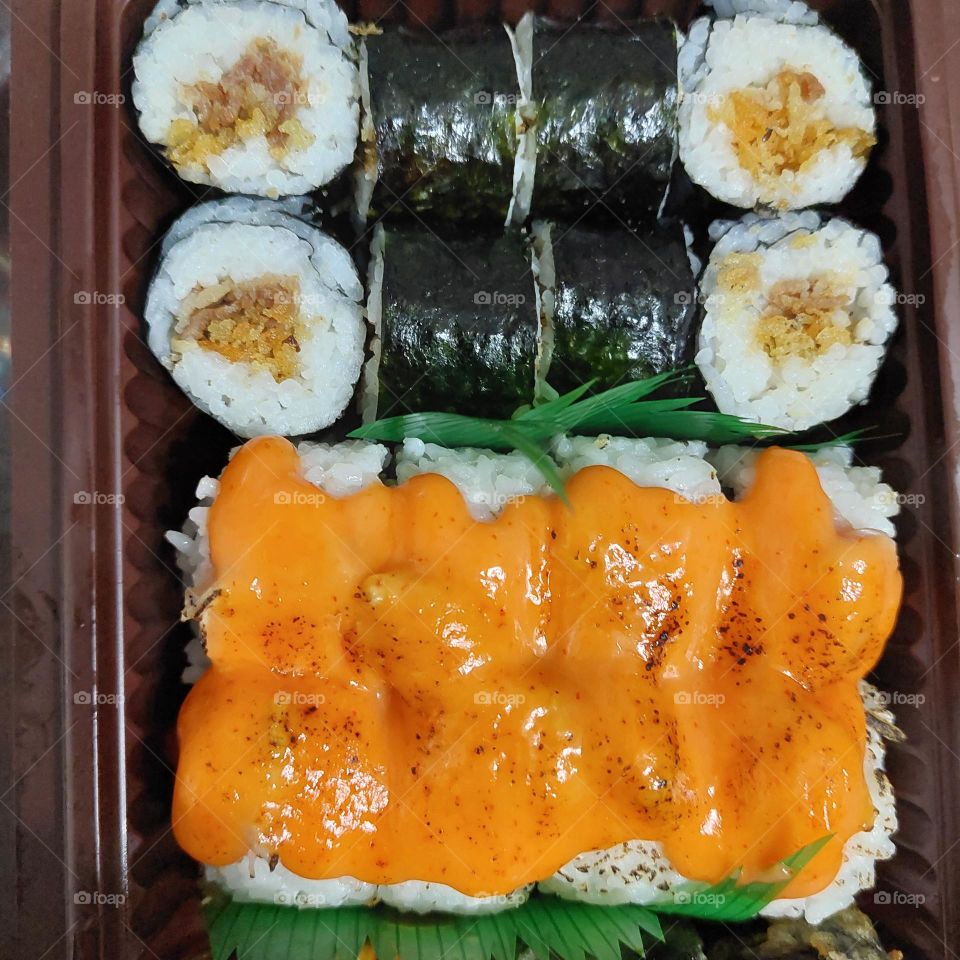 assorted sushi served in a container