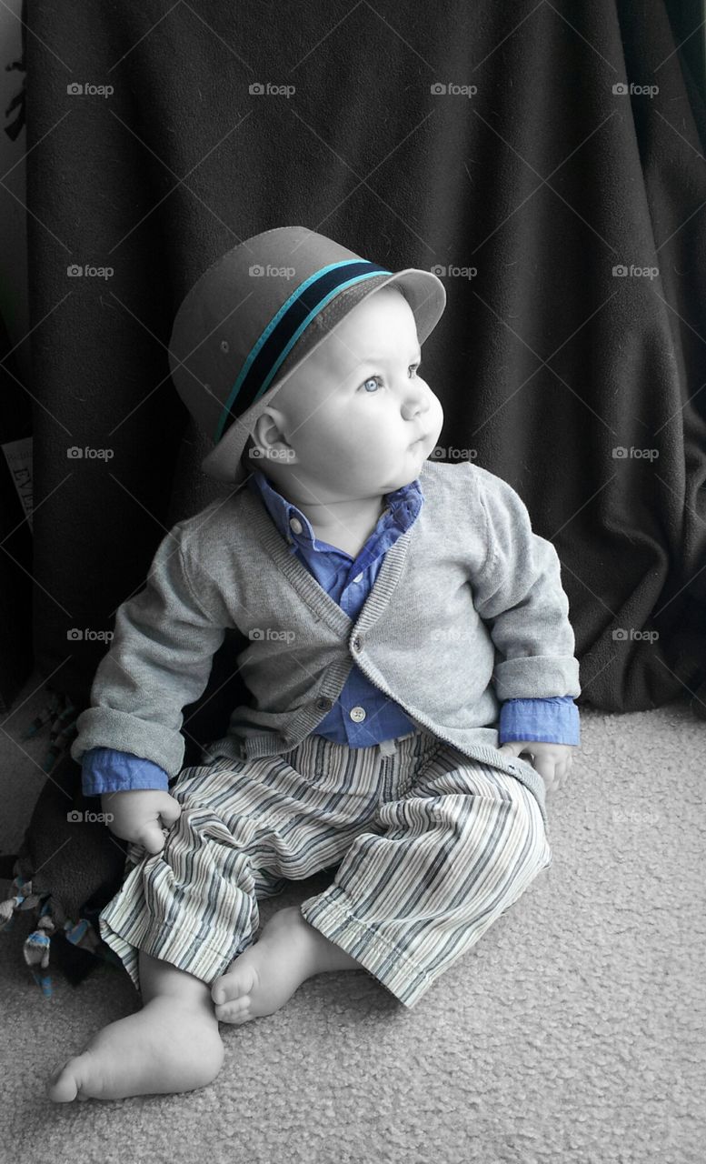 baby blue. another 8 month old picture of my son.  he was mesmerized by the snow outside. 
