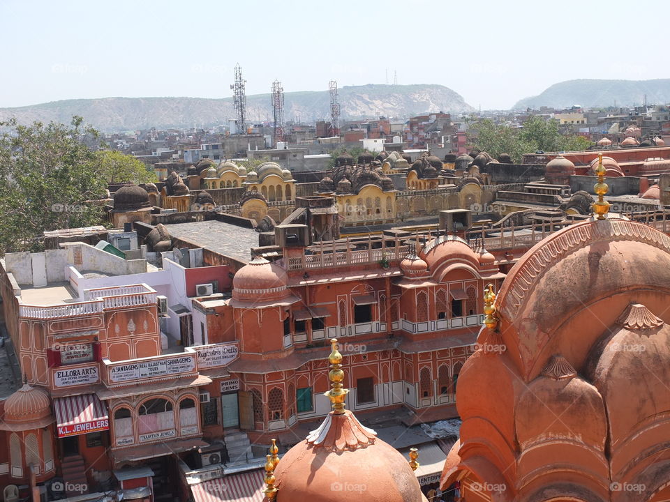 City from top. Jaipur is known as the Pink City and on arrival visitors will immediately understand the reasoning behind the name.The colour chosen was a terracotta pink as this colour historically represents welcoming and hospitality.