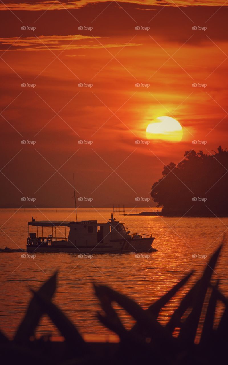 close up Boat against orange sunset