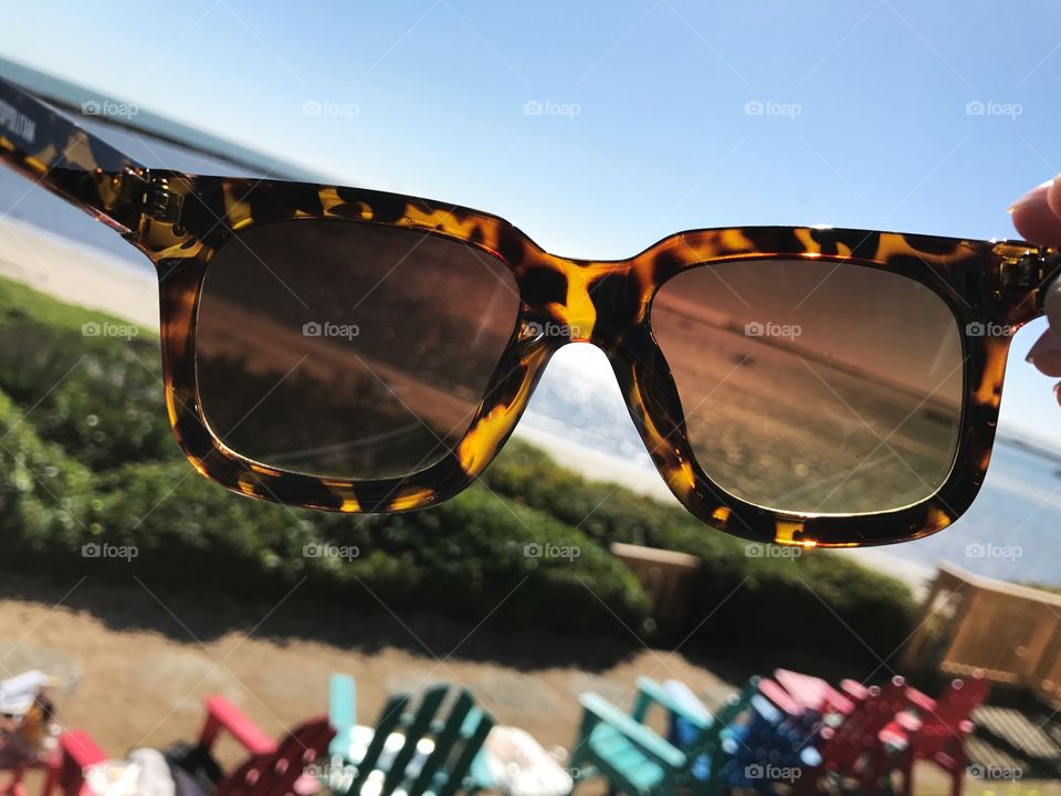 Beach through the sunglass lenses