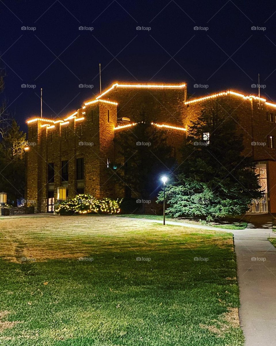 Christmas lights on old building on college campus