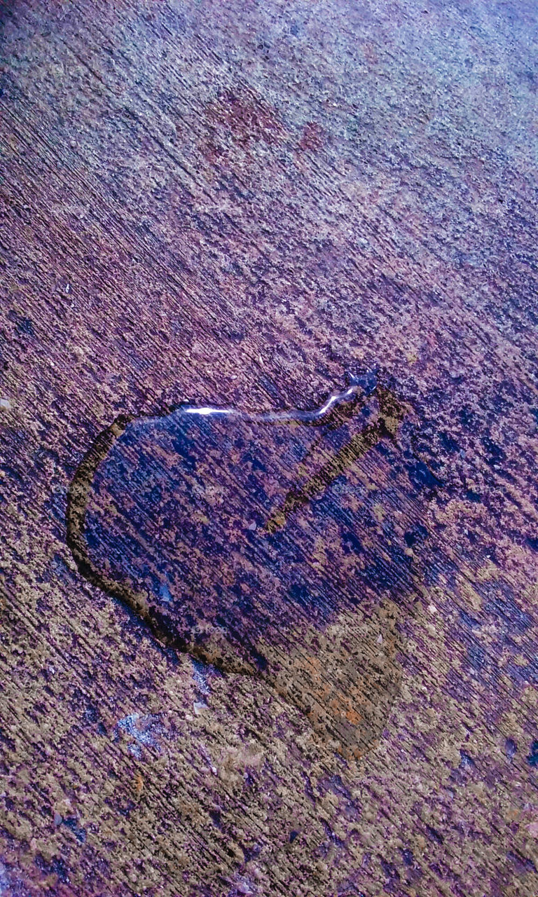 Heart shaped drop on pavement