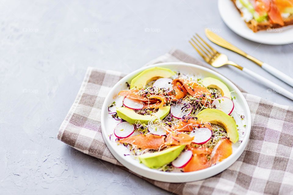 Healthy salad with fresh vegetables and micro greens 