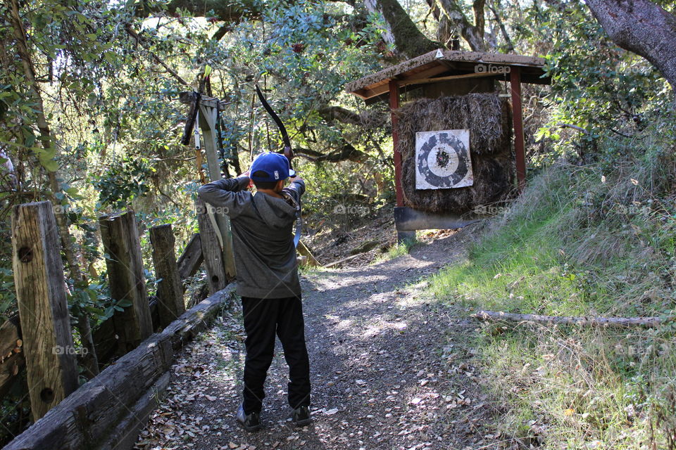 My boy hard at work to get better at archery with his longbow. Practice makes perfect! 