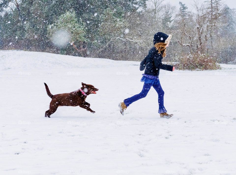 Girl running with her dog