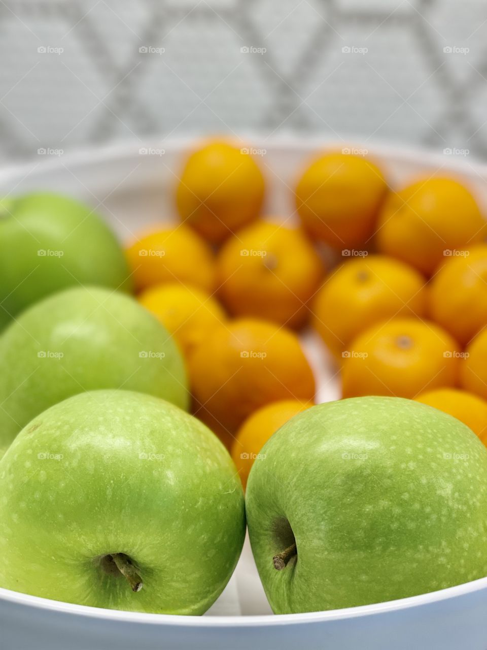 Foap Mission Fruits! Bright Green Apples And Tangerines In A White Bowl With Blurred Background!