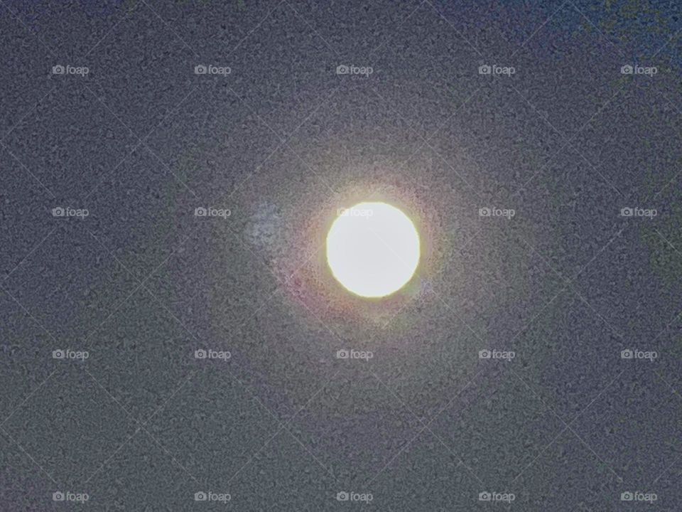 A full moon rising over Newtown Creek in Long Island City, Queens, NY gives off a magnetic mesmerizing glow. 2021. Hypnotic Productions