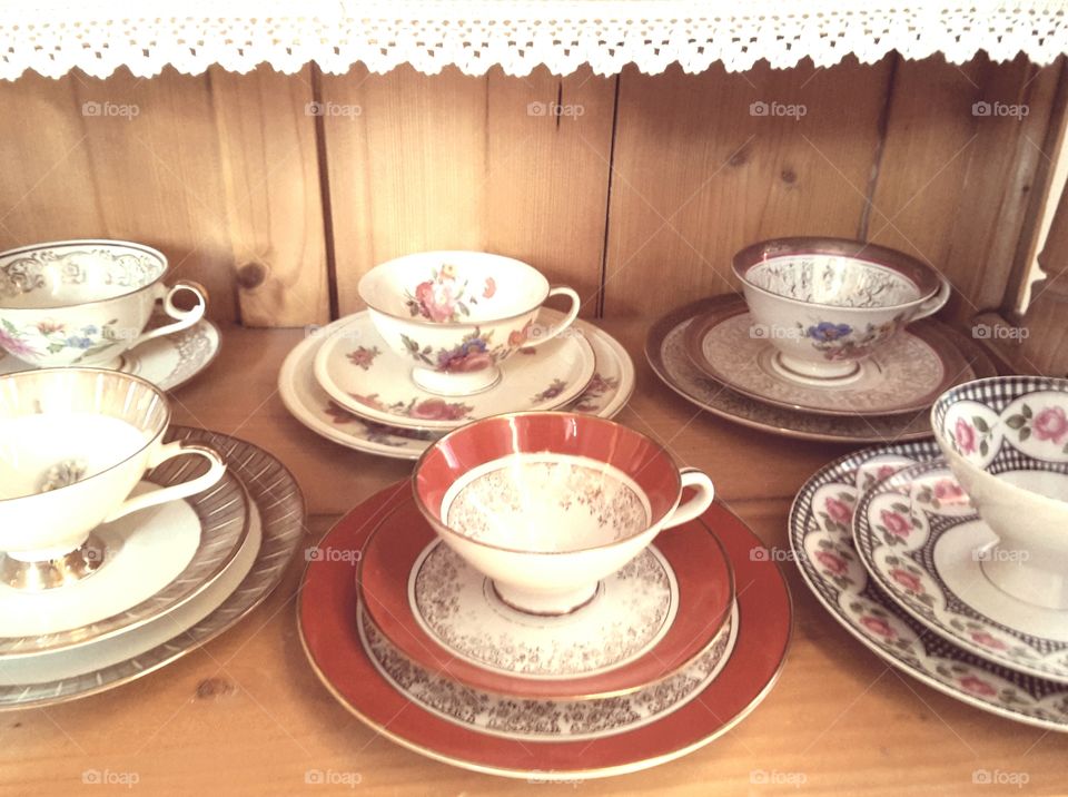 old porcelain present ein an open cupboard