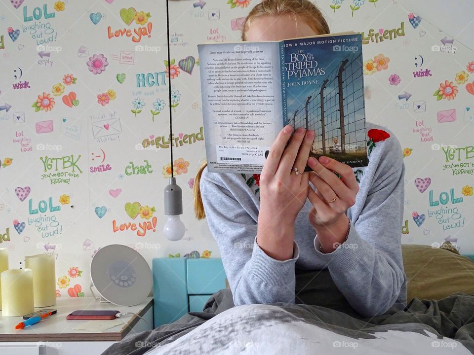 Reading a book in bed