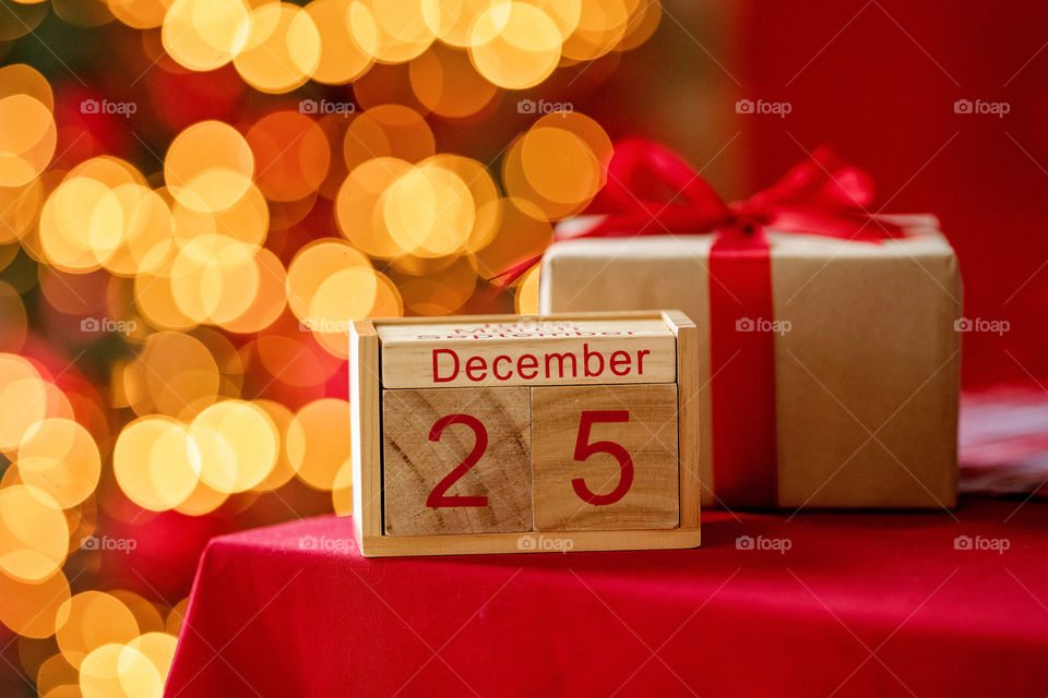 Christmas background with wooden block calendar with the date of December 25