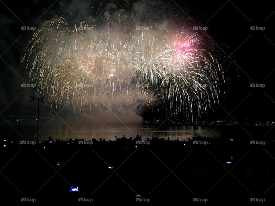 Happy people watching fireworks