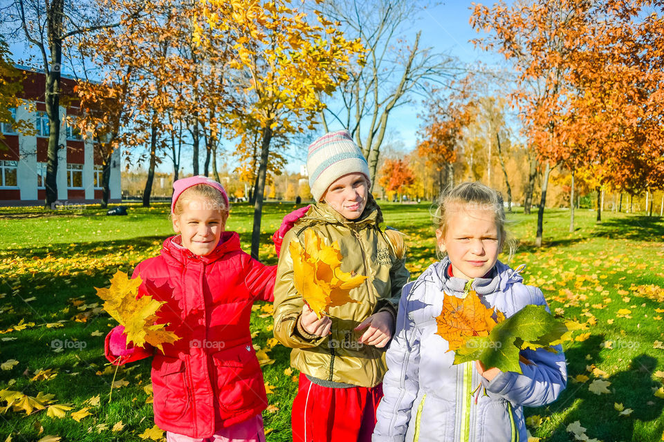 three girls in the autumn park