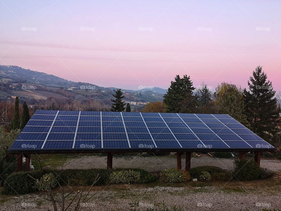 solar panels photographed at sunset