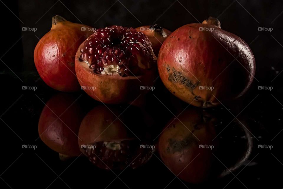 Pomegranate. A round fruit with many large, healthy and also circular seeds.