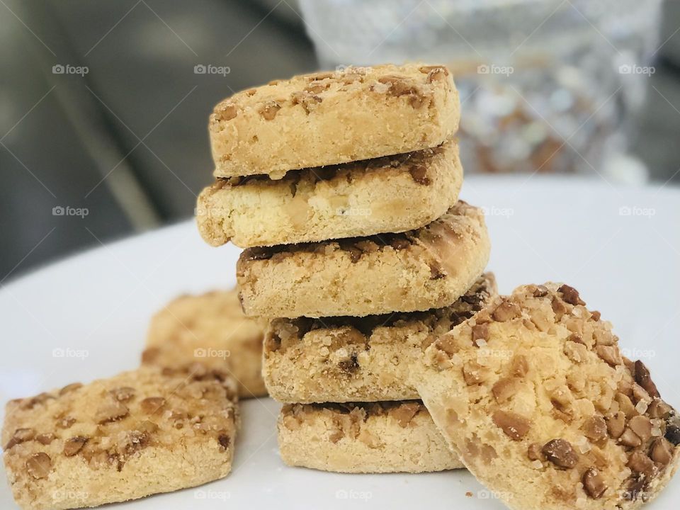 Dry fruits coated Indian cookies on a plate 