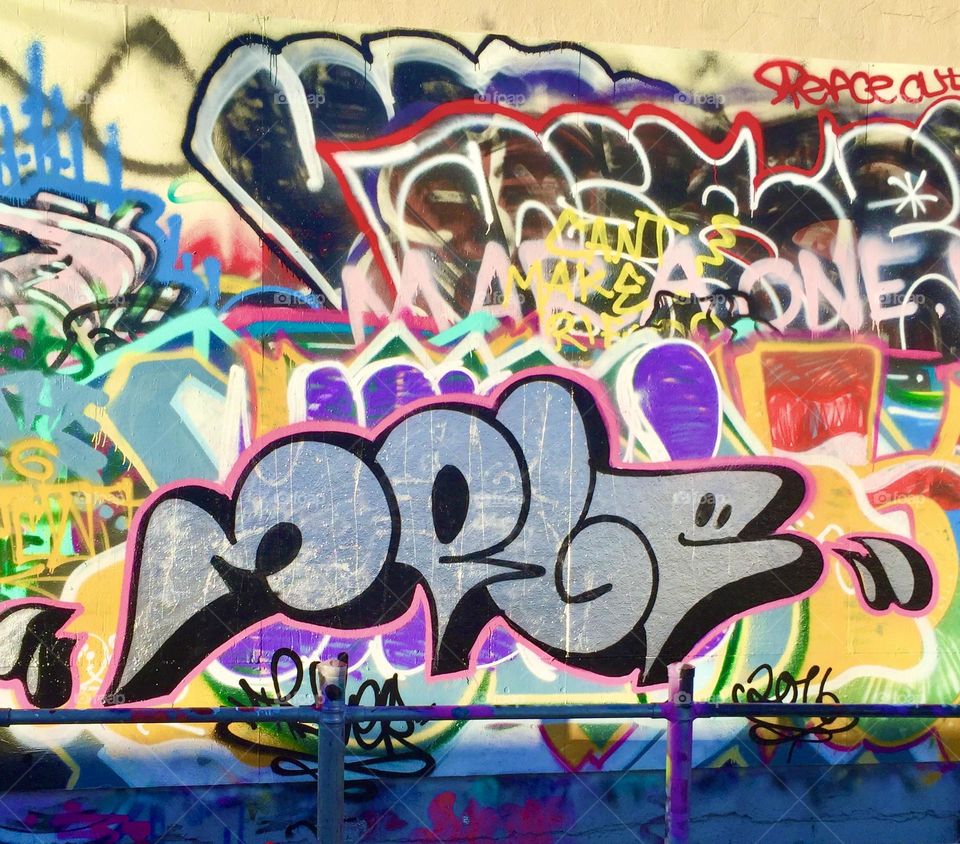 Graffiti on the back of a tire shop. 