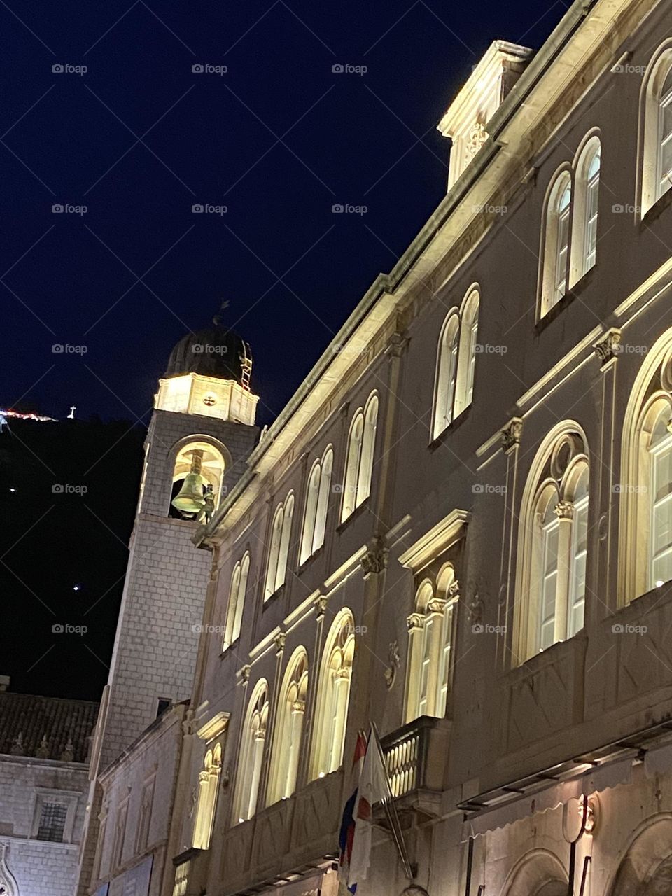 Lighting and architecture against night sky.