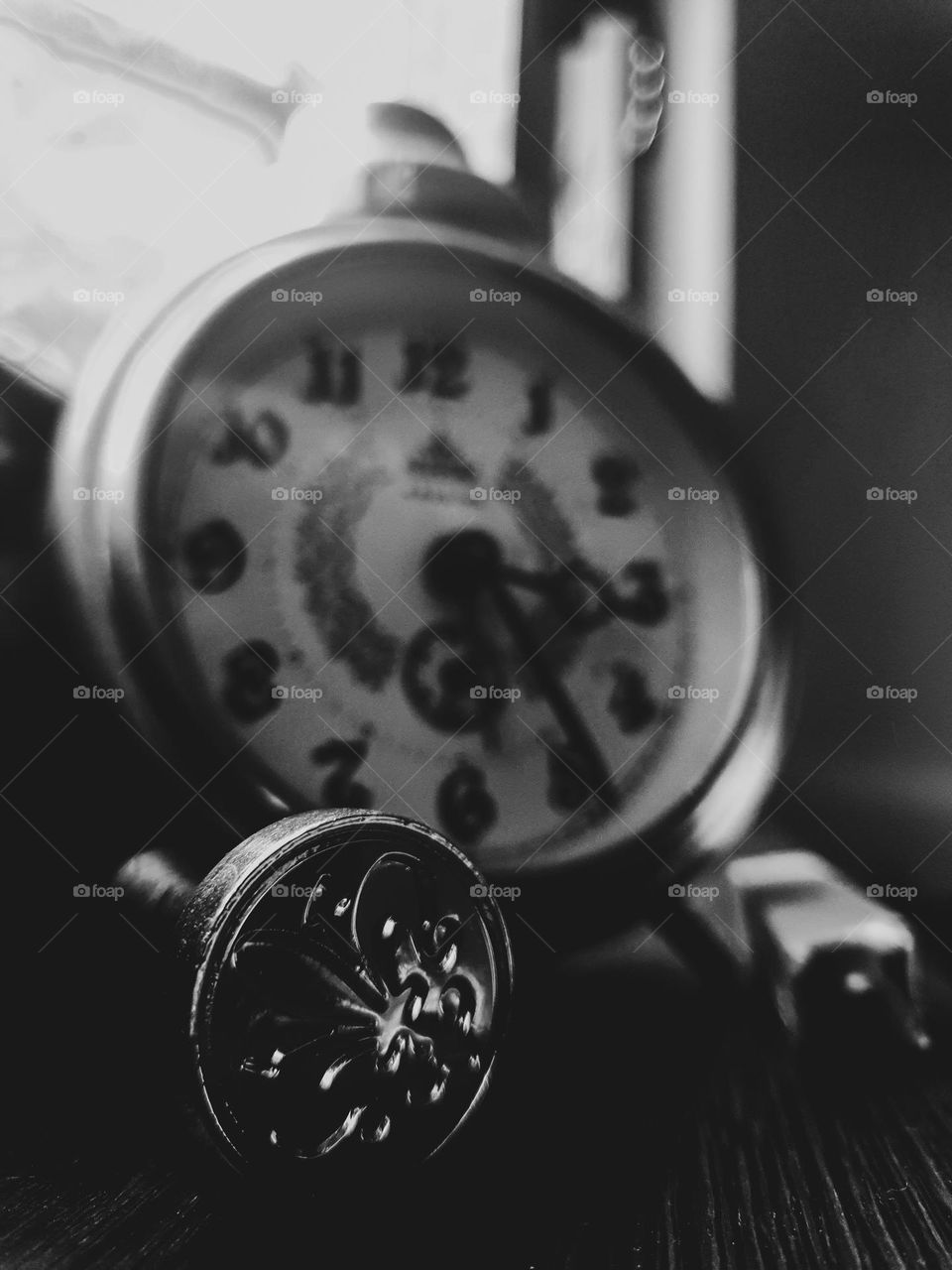 This picture represents a small part of an old world. A vintage watch and an old royal stamp