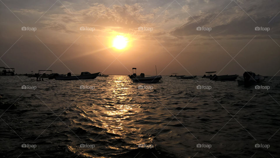 Local fishermen boats in sunset