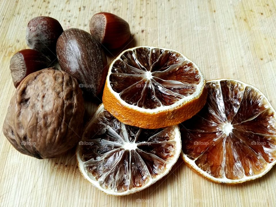 dryied fruits and nuts on wooden background