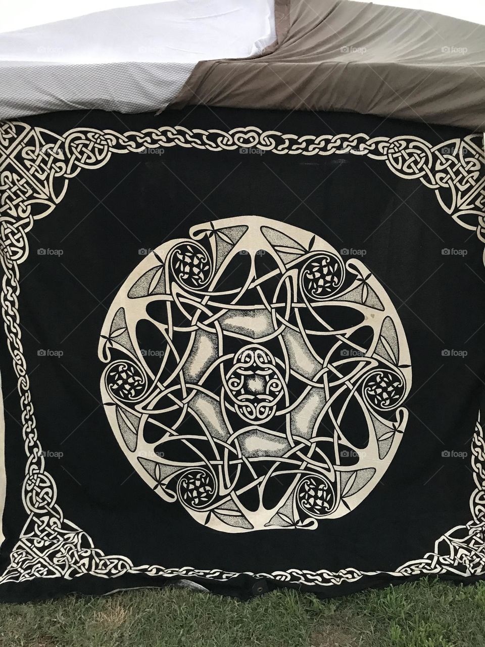 An immense Celtic design adorn the back of a tent at the Kearney Park Renaissance Faire in the weekend.