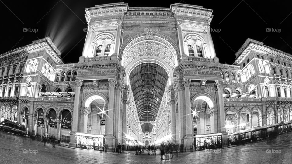 Night in Milan. The magnificent "Galleria Vittorio Emanuele II" with its palaces and shops, view from the cathedral square.