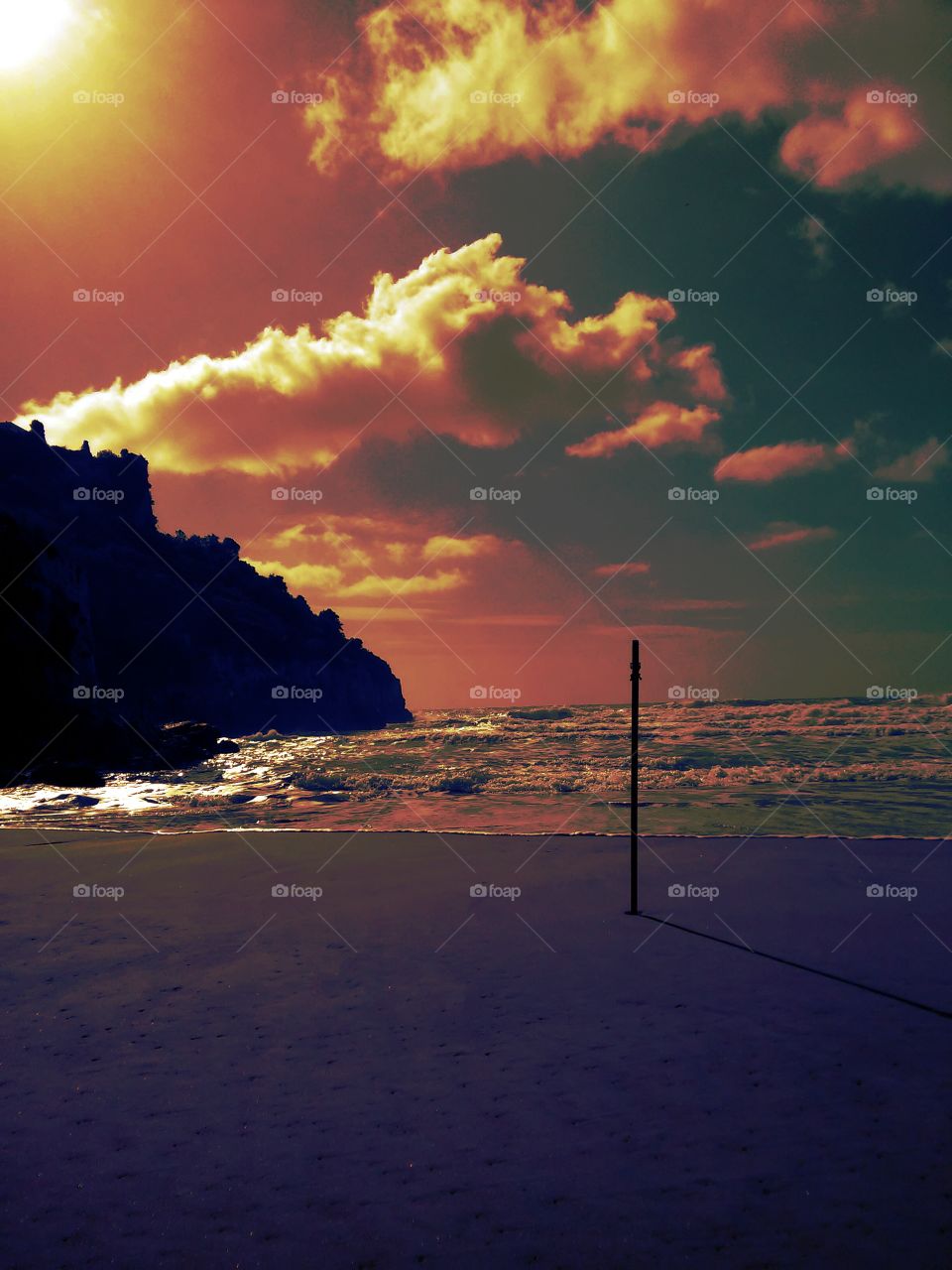 Silhouette of mountain against dramatic sky