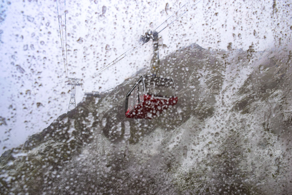 Raining and snowing while in the cable car 