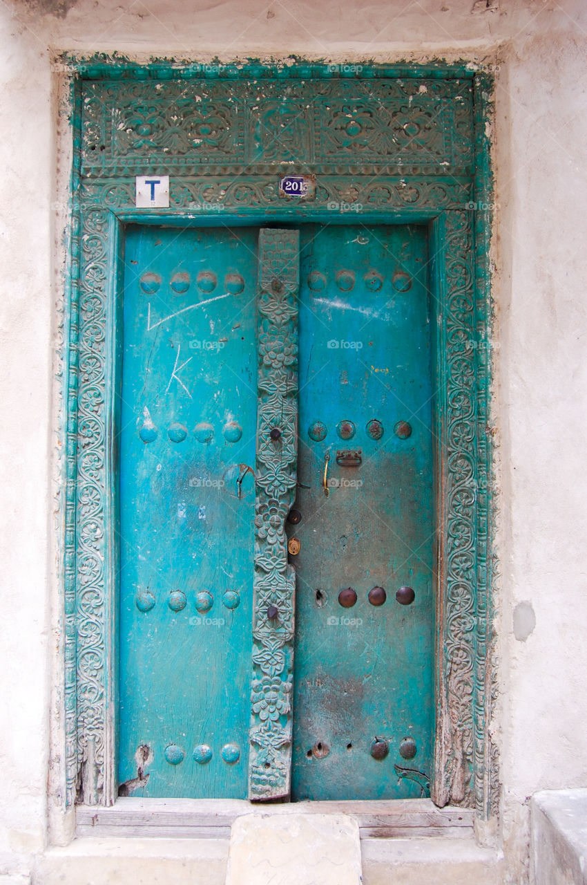 Old worn door in Stonetown on Zanzibar.